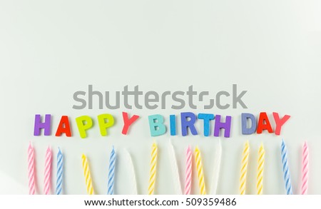Background picture of Variety of birthday candles in a row. Copy space.