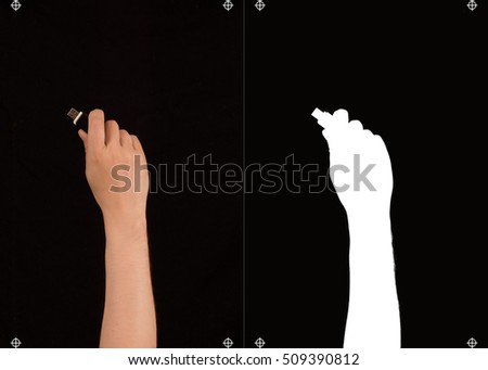 Hand with USB flash memory on a black background and a mask