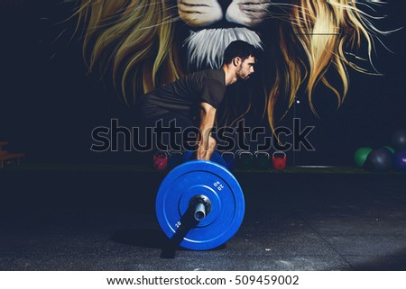 Young athlete practicing crossfit training Royalty-Free Stock Photo #509459002