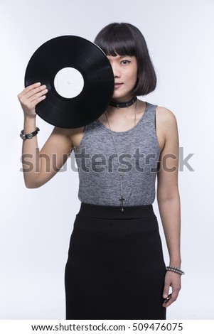 Party DJ, Nightclub, Music,Portrait of asian woman DJ with vinyl record  .