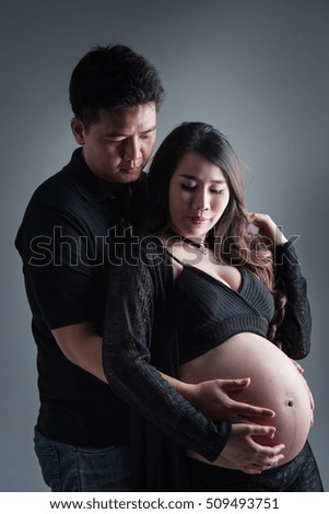 Beautiful future parents.asian pregnant wife and a happy husband