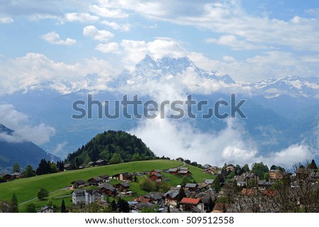 Leysin village in canton Vaud, Switzerland, with peaks of Dents du Midi mountains behind