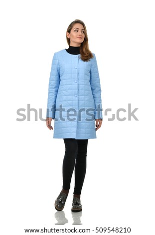 Full length pretty young woman in warm winter clothes jacket isolated on white background
