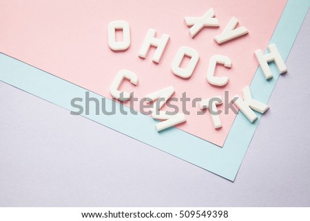 letters educational game on pastel paper