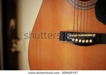 The old  folk guitar in music shop.