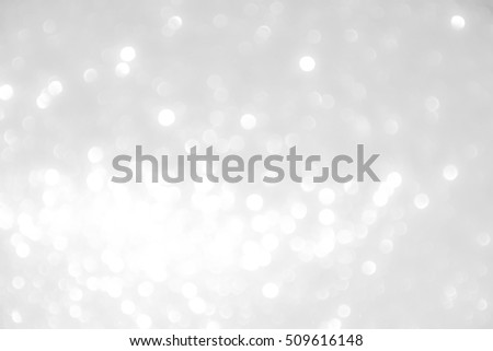 silver and white bokeh lights defocused. abstract background.