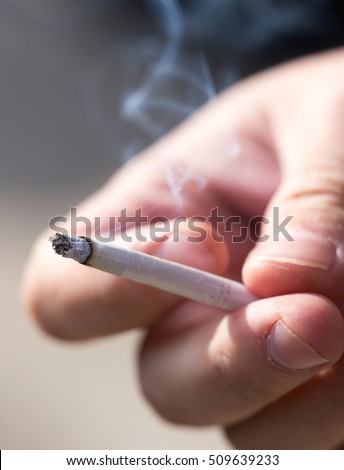 Cigarette burns in the hand