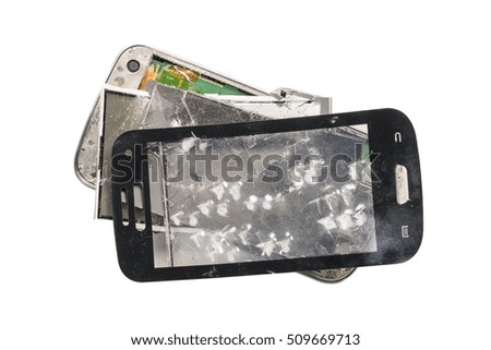 Parts of old broken phone on white background. Isolated