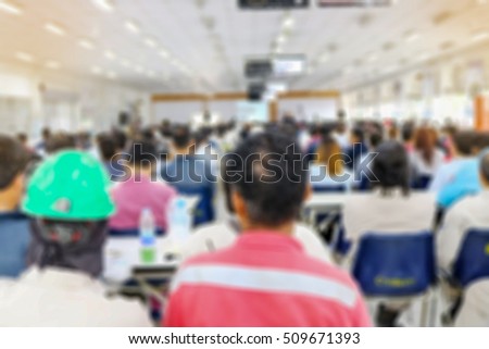Abstract blurred people doing workshop in training room, education concept blurred background