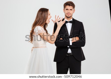Portrait of young couple conflict. girl screams