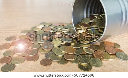 The concept of saving the money, coin of golden, copper, and silver colors