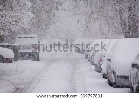 Parked cars covered with snow - snow storm Royalty-Free Stock Photo #509797831