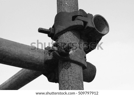 oxidation rusty steel tube scaffold, closeup of photo
