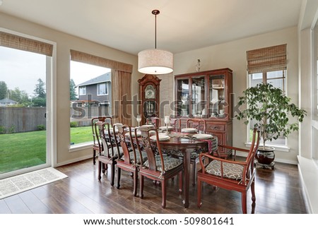 Classical interior of dining room in luxurious house with vintage furniture and hardwood floors. Northwest, USA