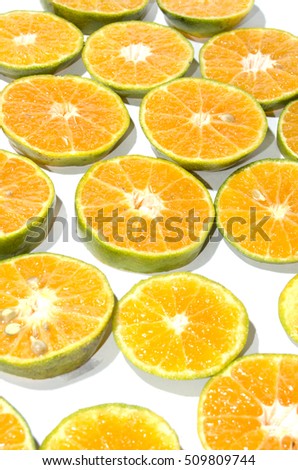 oranges slice in many piece with seed 