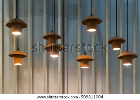 beautiful light bulbs decorated hanging made off wooden and clay pots modern style