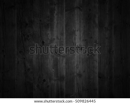 Black wooden background. Grunge texture. Old wood