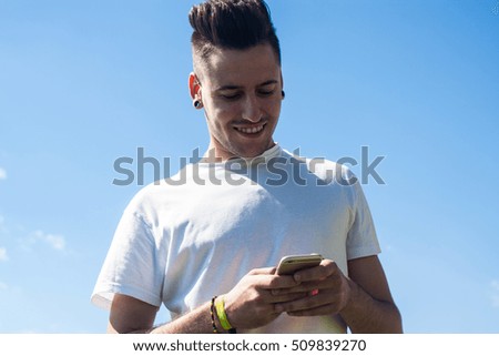 young man using his mobile phone