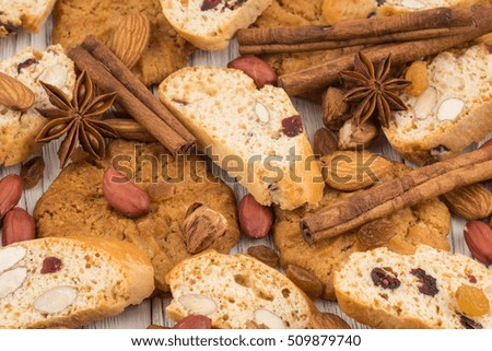 Cookies with almonds and raisins on the old wooden table.  Selective focus.