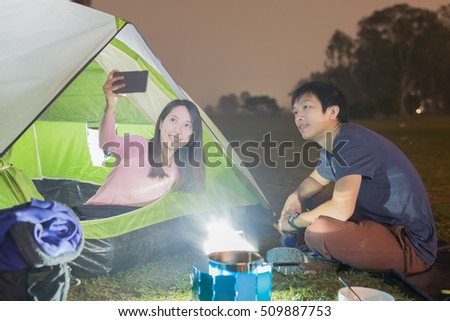 people are camping and selfie outdoor with tent, asian