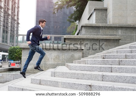 Businessman in hurry. Motion blurred people over office building in hongkong Royalty-Free Stock Photo #509888296