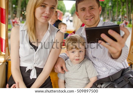 Young family is having fun in the park during the summer