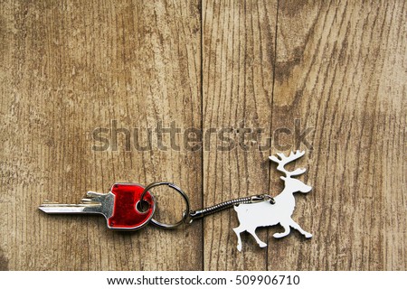 christmas keyring in shape of reindeer carrying a red  key 