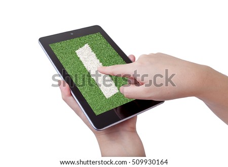 woman hand hold and touch screen smart phone, tablet,cellphone isolated on white 
with football field on screen ,abstract background to sport football or soccer online .
