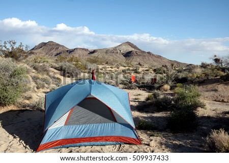 The rugged and mountainous Mojave Desert lies east of Los Angeles, California, in a dry rocky landscape where some plants and animals manage to thrive. Royalty-Free Stock Photo #509937433