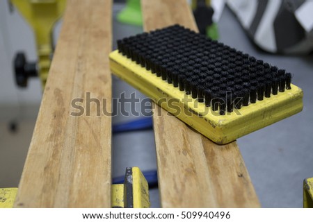sponge brush and snowboard wax and ski in the workshop