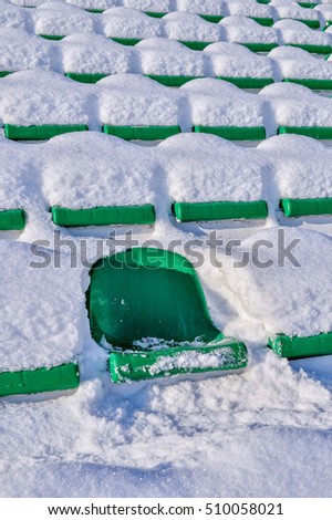 Background chairs at stadium , winter