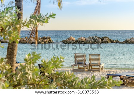 Front row seats by the sea at the mambo beach in Curacao Royalty-Free Stock Photo #510075538