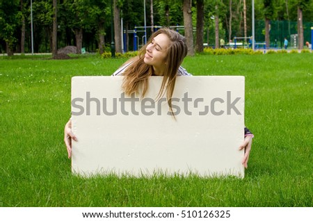 Young girl with the white banner in the city