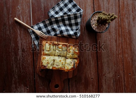 Pizza toasted bread with tomato sauce and ham cheese selective focus, picture vintage style 