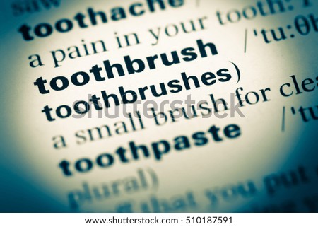 Close up of old English dictionary page with word toothbrush