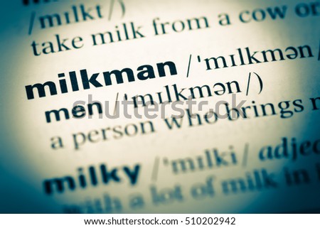 Close up of old English dictionary page with word milkman