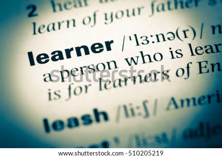 Close up of old English dictionary page with word learner Royalty-Free Stock Photo #510205219