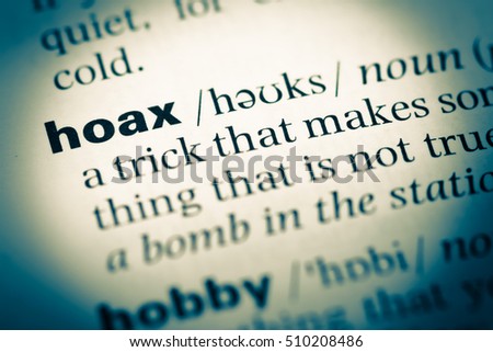 Close up of old English dictionary page with word hoax Royalty-Free Stock Photo #510208486