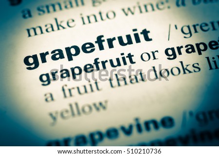 Close up of old English dictionary page with word grapefruit