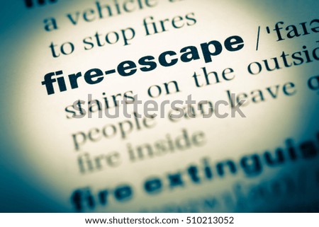 Close up of old English dictionary page with word fire escape