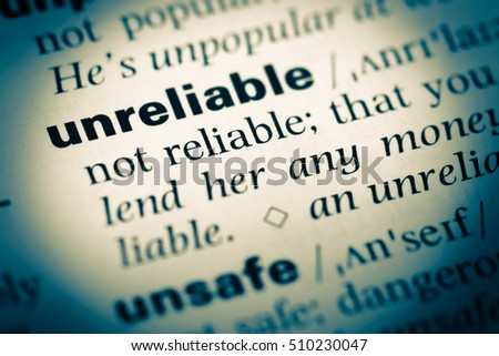 Close up of old English dictionary page with word unreliable Royalty-Free Stock Photo #510230047