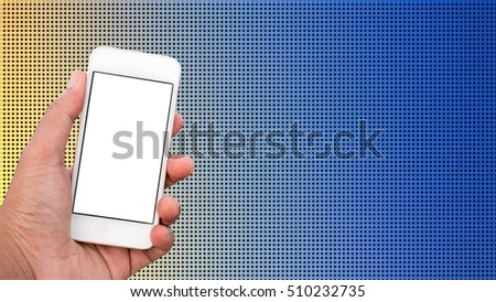 Hand holding mobile smart phone with blank screen in vertical position, dot background - mockup template