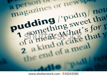Close up of old English dictionary page with word pudding