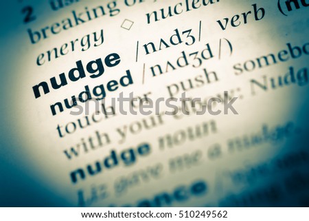 Close up of old English dictionary page with word nudge Royalty-Free Stock Photo #510249562