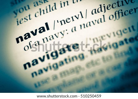 Close up of old English dictionary page with word naval
