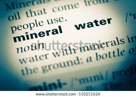Close up of old English dictionary page with word mineral water