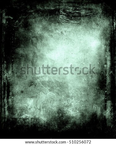 Abstract grunge scary texture background with black frame and faded central area for your text or picture
