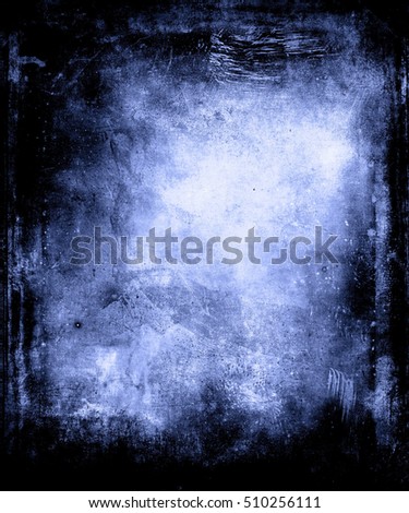 Abstract blue grunge scary texture background with black frame and faded central area for your text or picture
