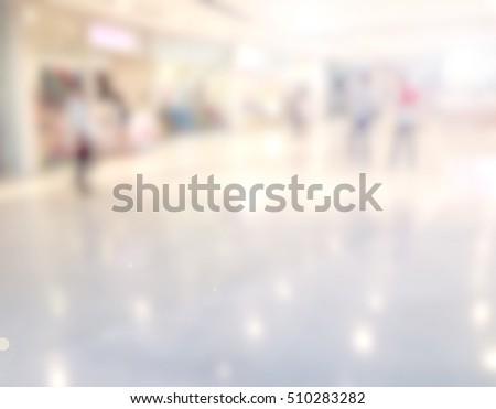 blurred image of shopping mall and people, in department store.
