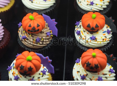 Close up of fancy Halloween pumpkin cupcakes